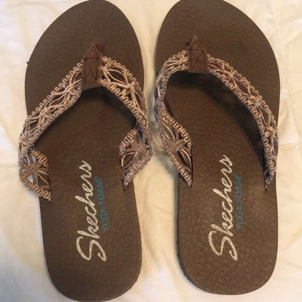 Brown Skechers yoga foam sandals